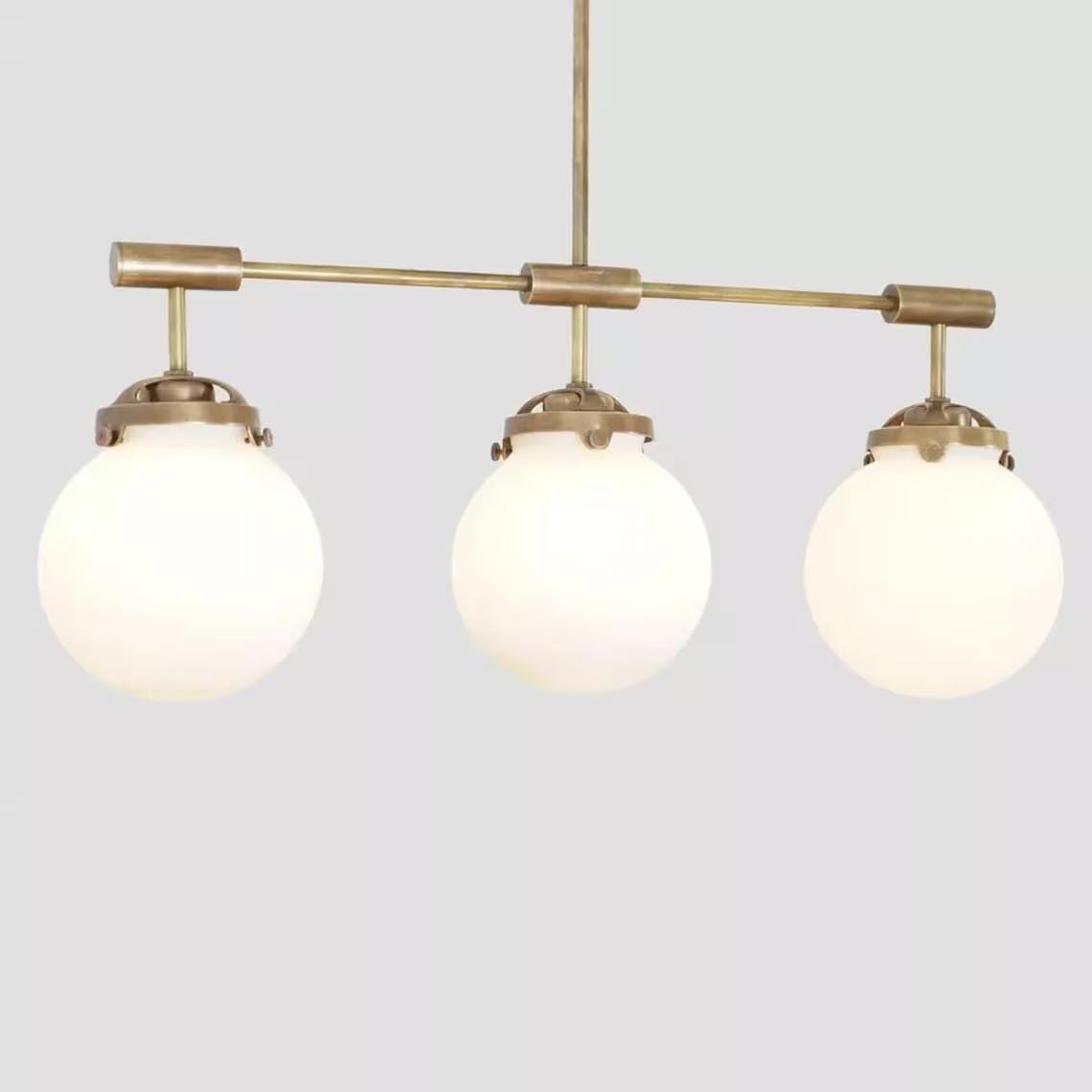 Hanging light Mid Century Style 3 Glass Globe Brass fixture Raw Brass Finish Bedroom