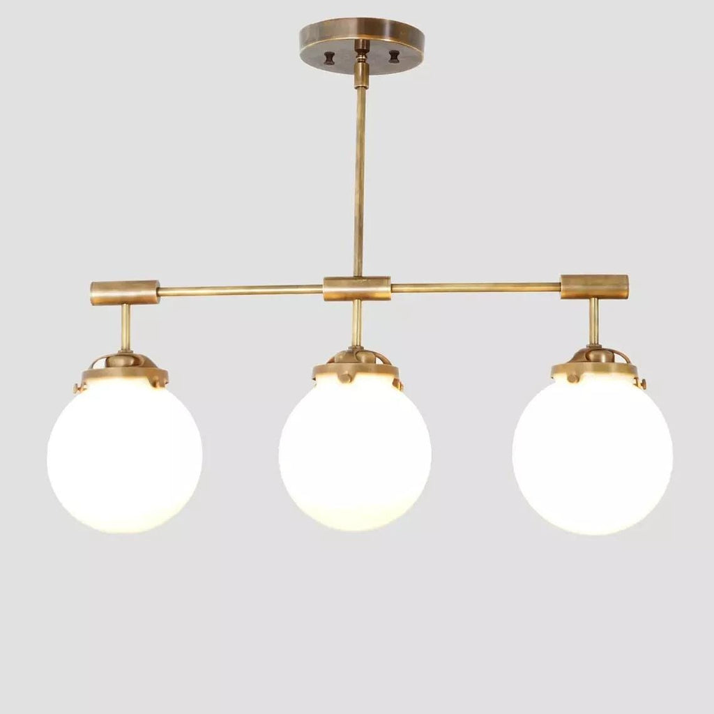 Hanging light Mid Century Style 3 Glass Globe Brass fixture Raw Brass Finish Bedroom