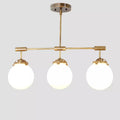 Hanging light Mid Century Style 3 Glass Globe Brass fixture Raw Brass Finish Bedroom